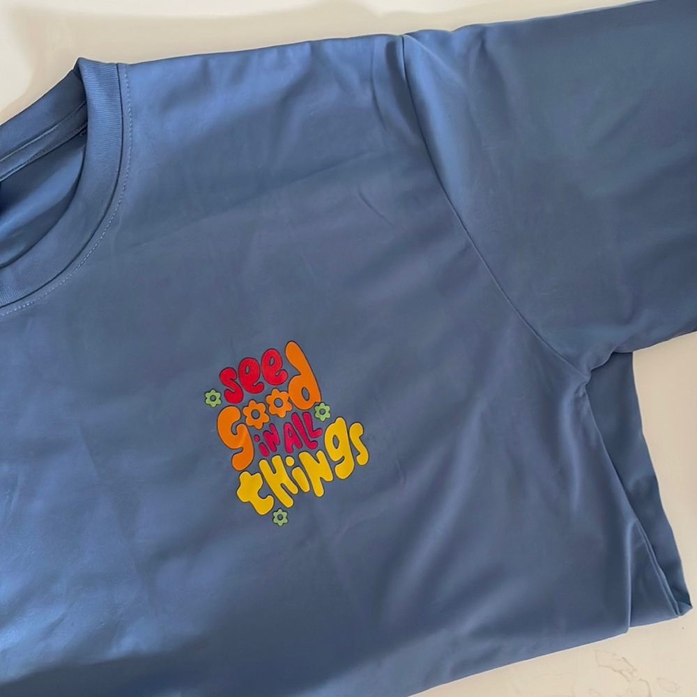 Oversized comfy light blue shirt with a positive message.